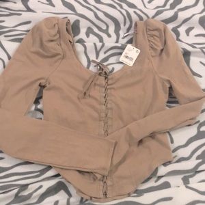 Recyclable (100% post-consumer waste) fitted top with corset laced front. Medium